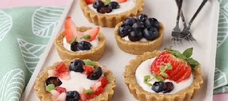 5 fruit tarts on rectangle plate from La Lunes Sucree