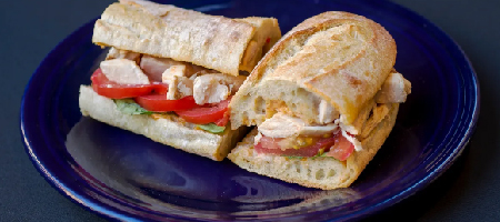 Chicken sandwich on plate from La Lunes Sucree