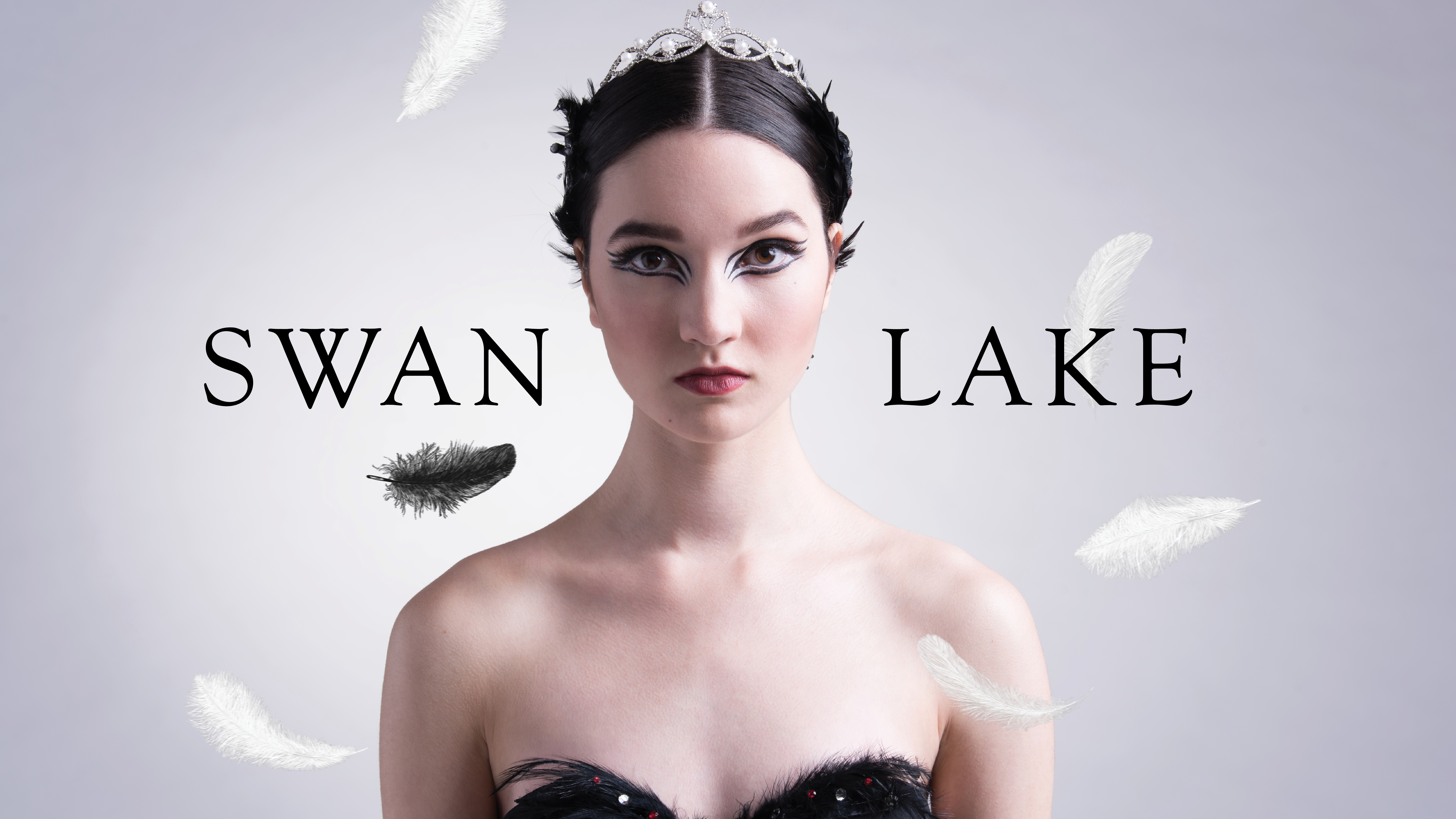 Hammer 1920x1080 IMAGE AND TITLE cool gray background with a bust photo of a ballet performer wearing a tiara; the title in black saying "Swan Lake"