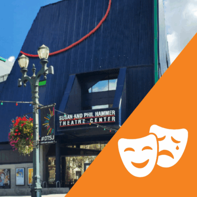 The dark blue structure of the front of hammer theatre, a light post placed in front. In the right corner is an icon of theatre masks