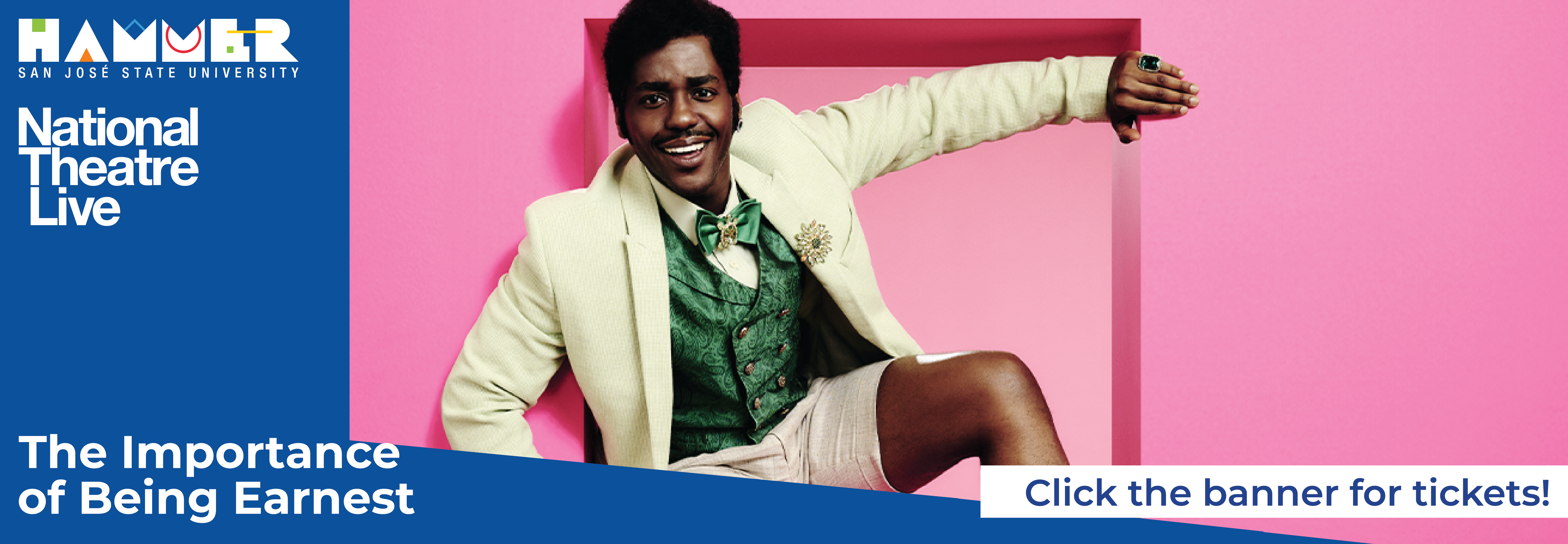 actor Ncuti Gatwa smiling at the camera coming out of a pink square box